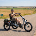 Fat-tyre semi-recumbent electric trike on a US coastal gravel path