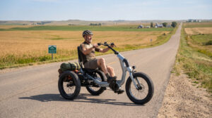 Fat-tyre semi-recumbent electric trike on a US coastal gravel path